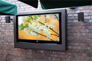 Armagard outdoor tv enclosue mounted on a patio wall